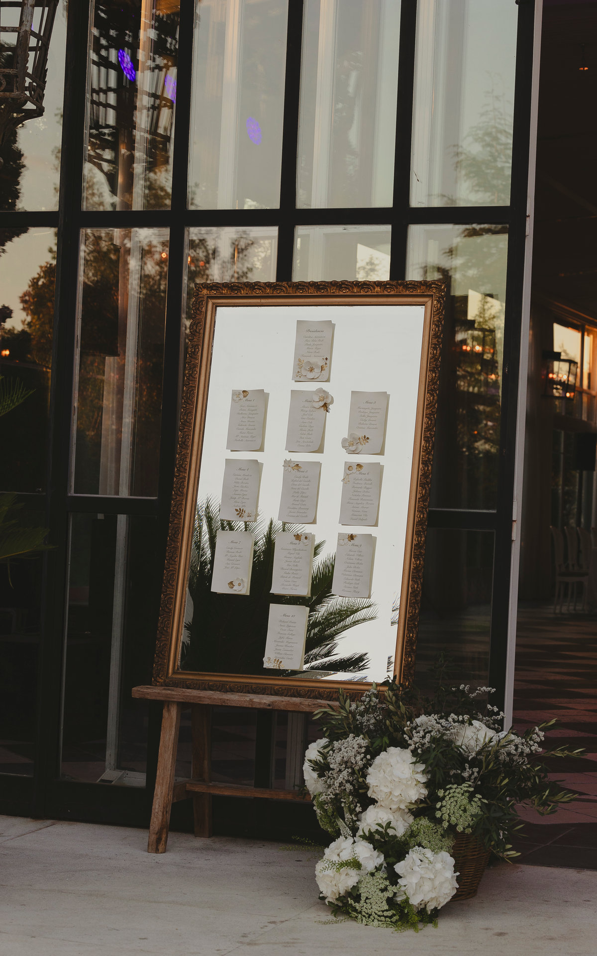 Seating chart displayed in an ornate mirror frame