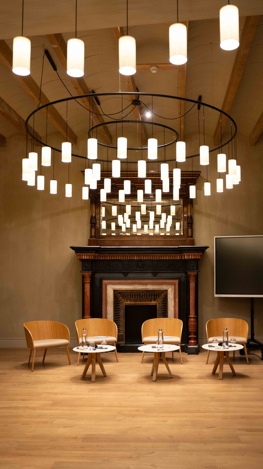 Chandelier above a fireplace at an event venue