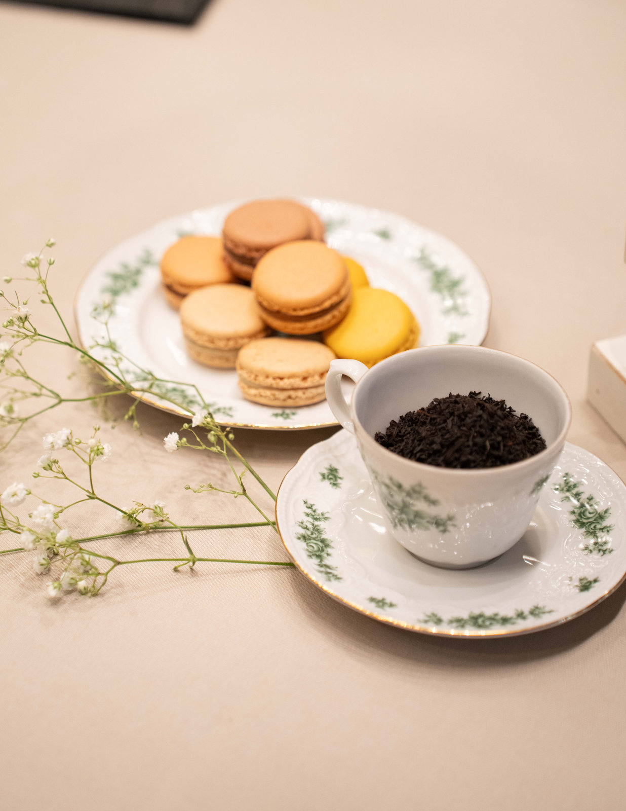 Macarons and tea served on floral china