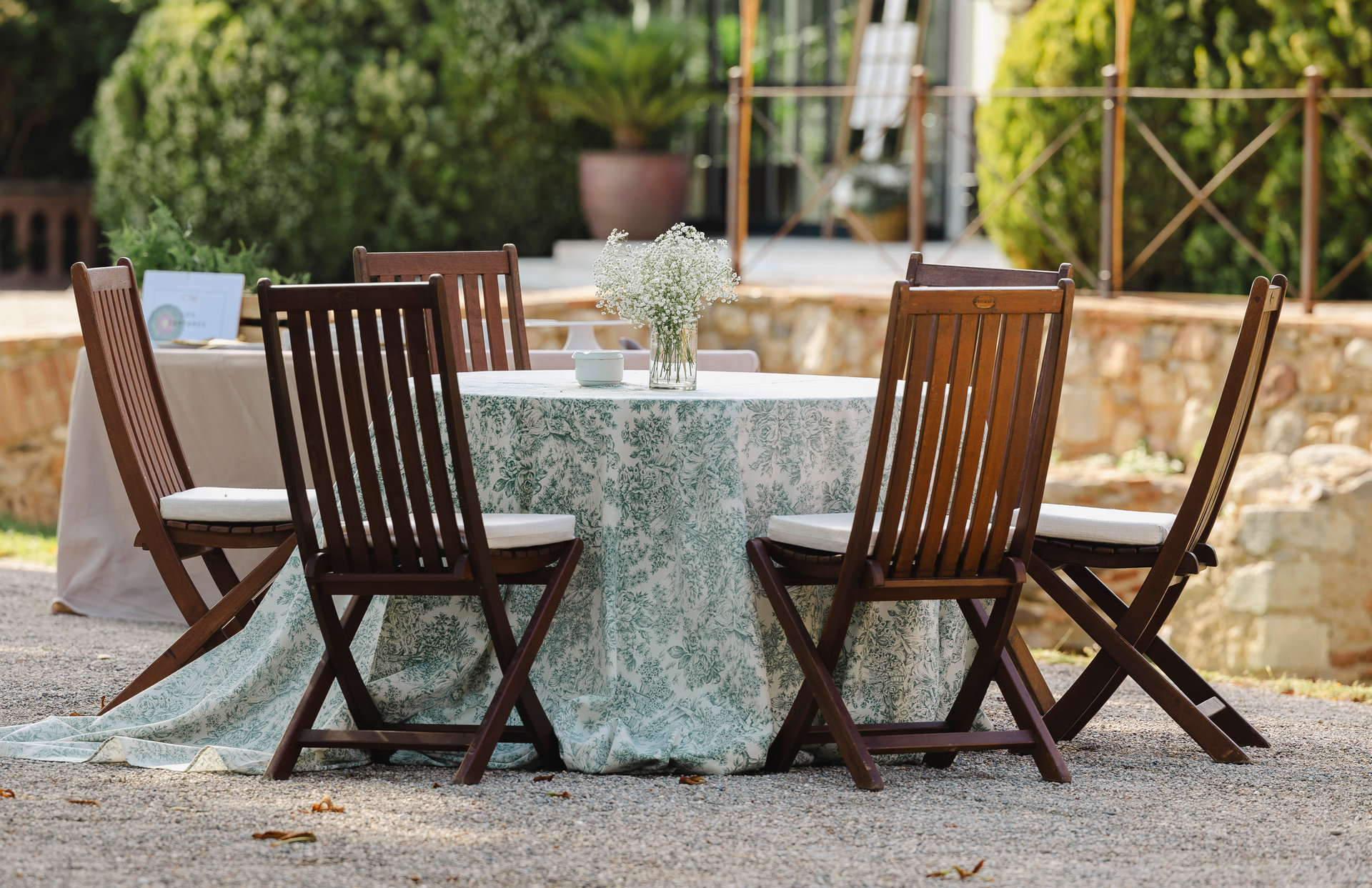 Outdoor wedding table with flowers in a garden setting